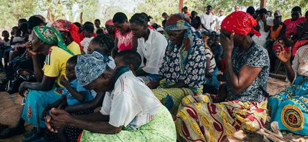 A Group of Zambians Bow Their Heads During Church