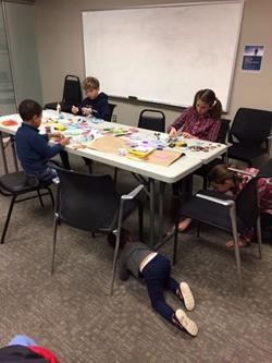 Children making holiday decorations