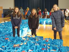 Volunteers stuffing bags for Operation Turkey